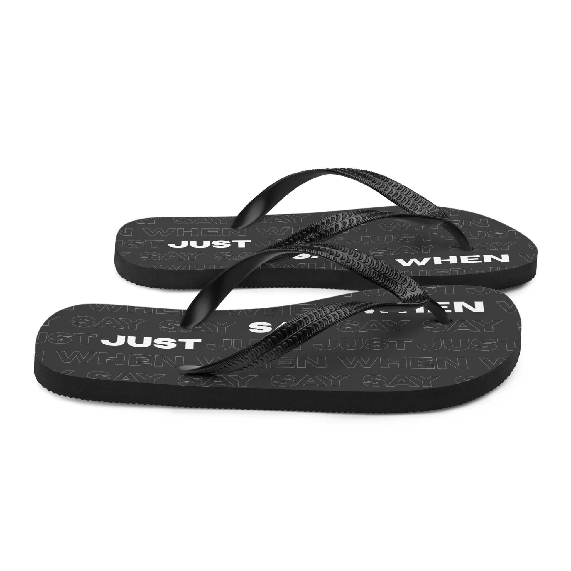 right view of the capital flip-flops in black with bold white ‘just say when’ text and a subtle repeating pattern.