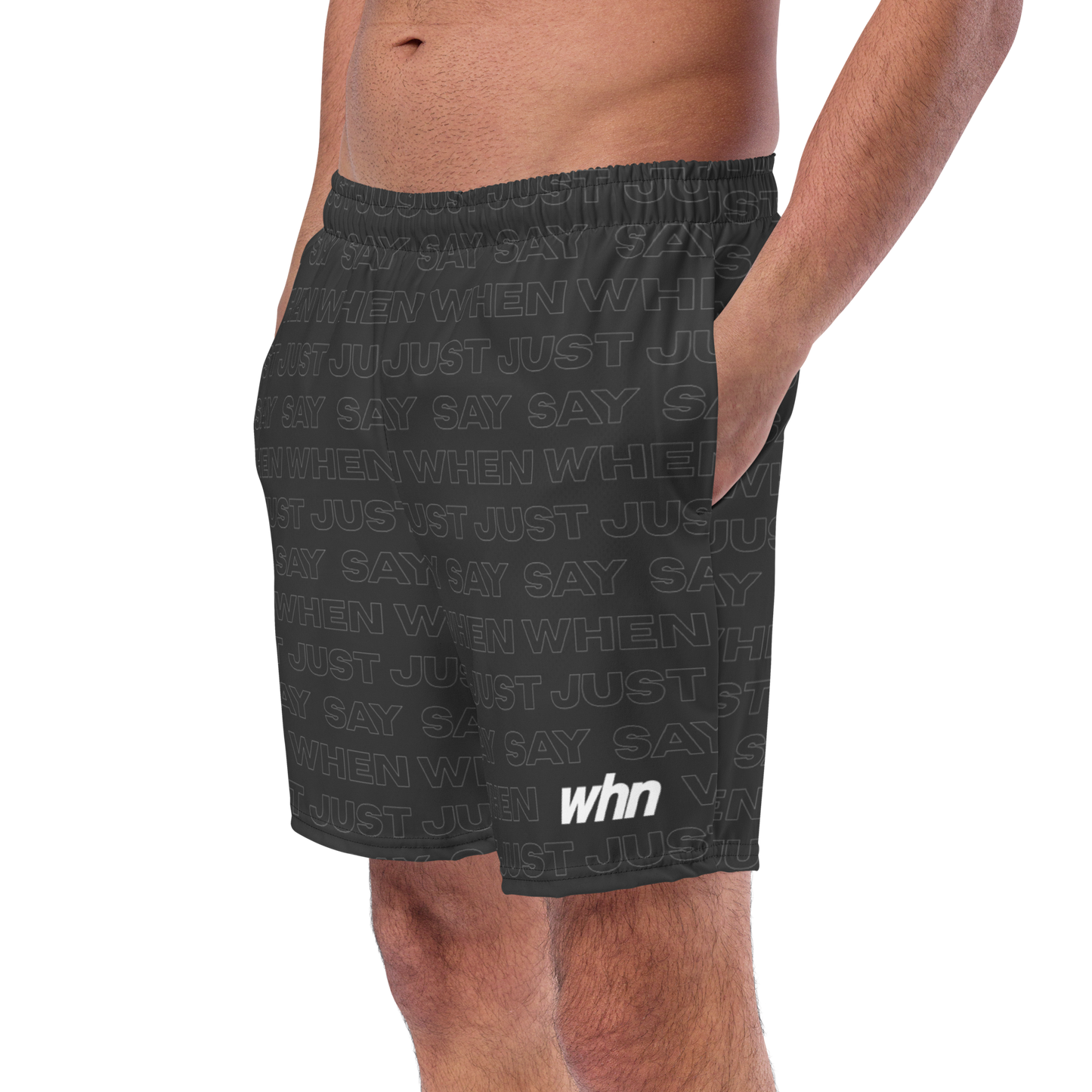 model wearing the capital swim shorts in black featuring an all-over 'just say when' pattern and white whn logo near the hem.