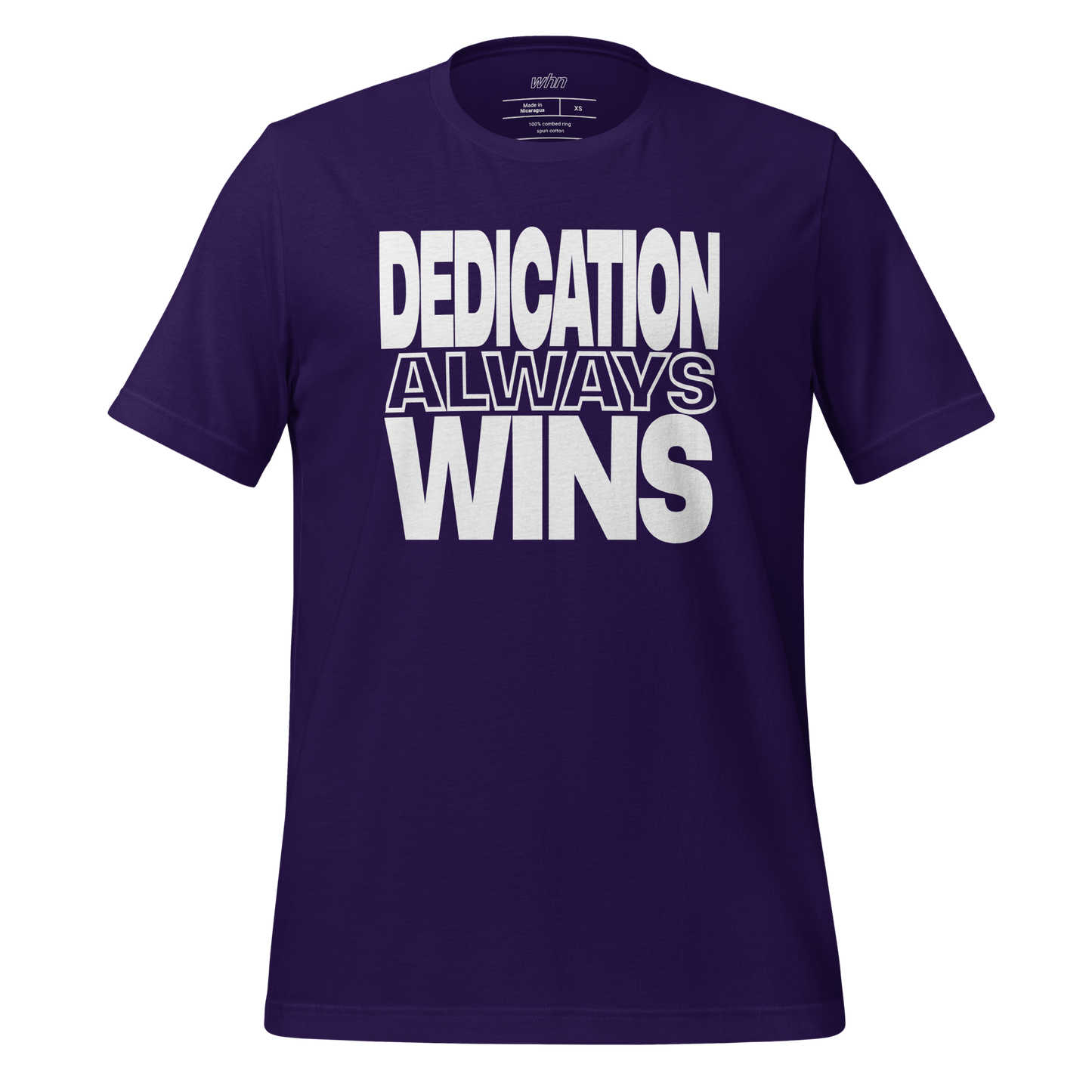the dedication shirt in purple featuring bold white text that reads 'dedication always wins' across the chest.