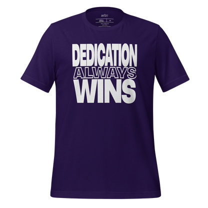 the dedication shirt in purple featuring bold white text that reads 'dedication always wins' across the chest.