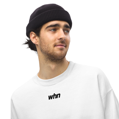 model wearing the humble sweatshirt featuring a black logo in the middle
