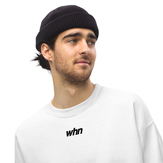 model wearing the humble sweatshirt featuring a black logo in the middle