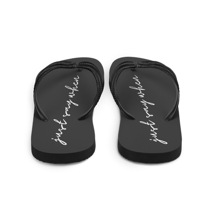 rear view of the just say flip-flops in black featuring white cursive text that reads ‘just say when’.