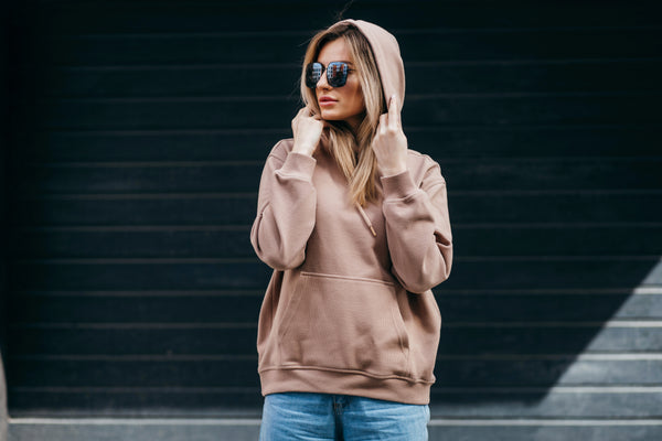 woman in brown oversized hoodie